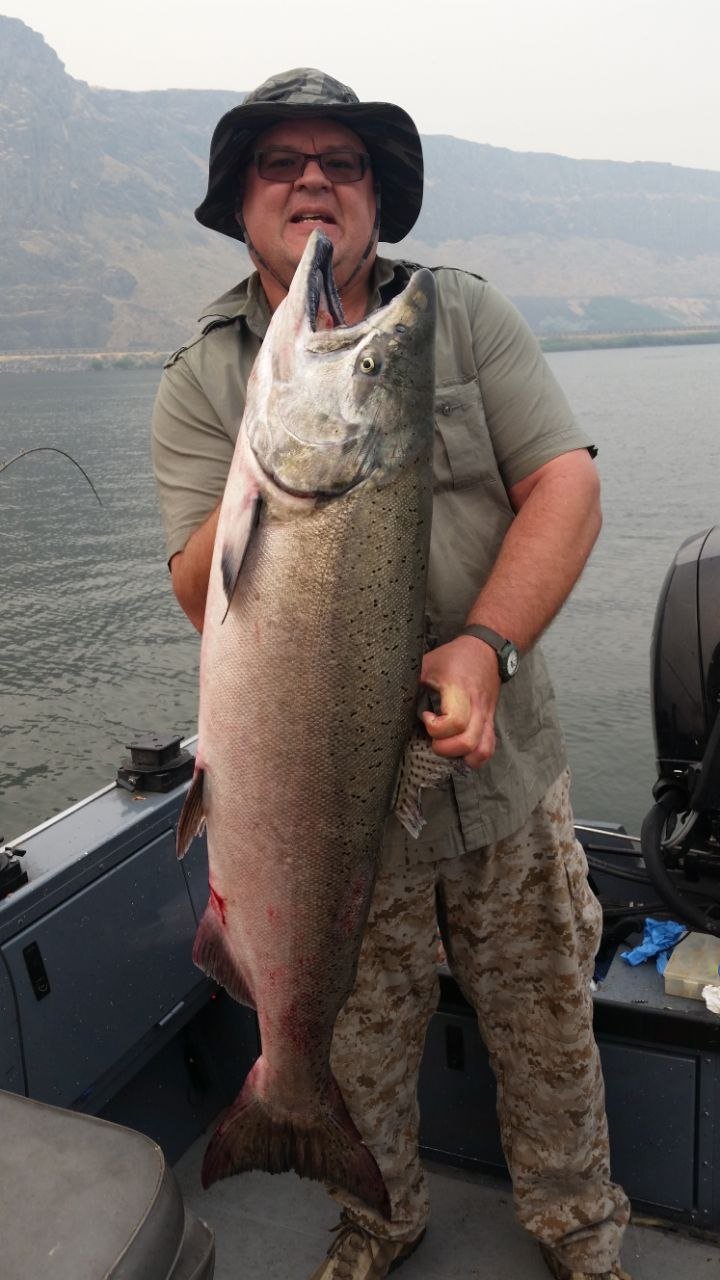 Angler holding a large sturgeon