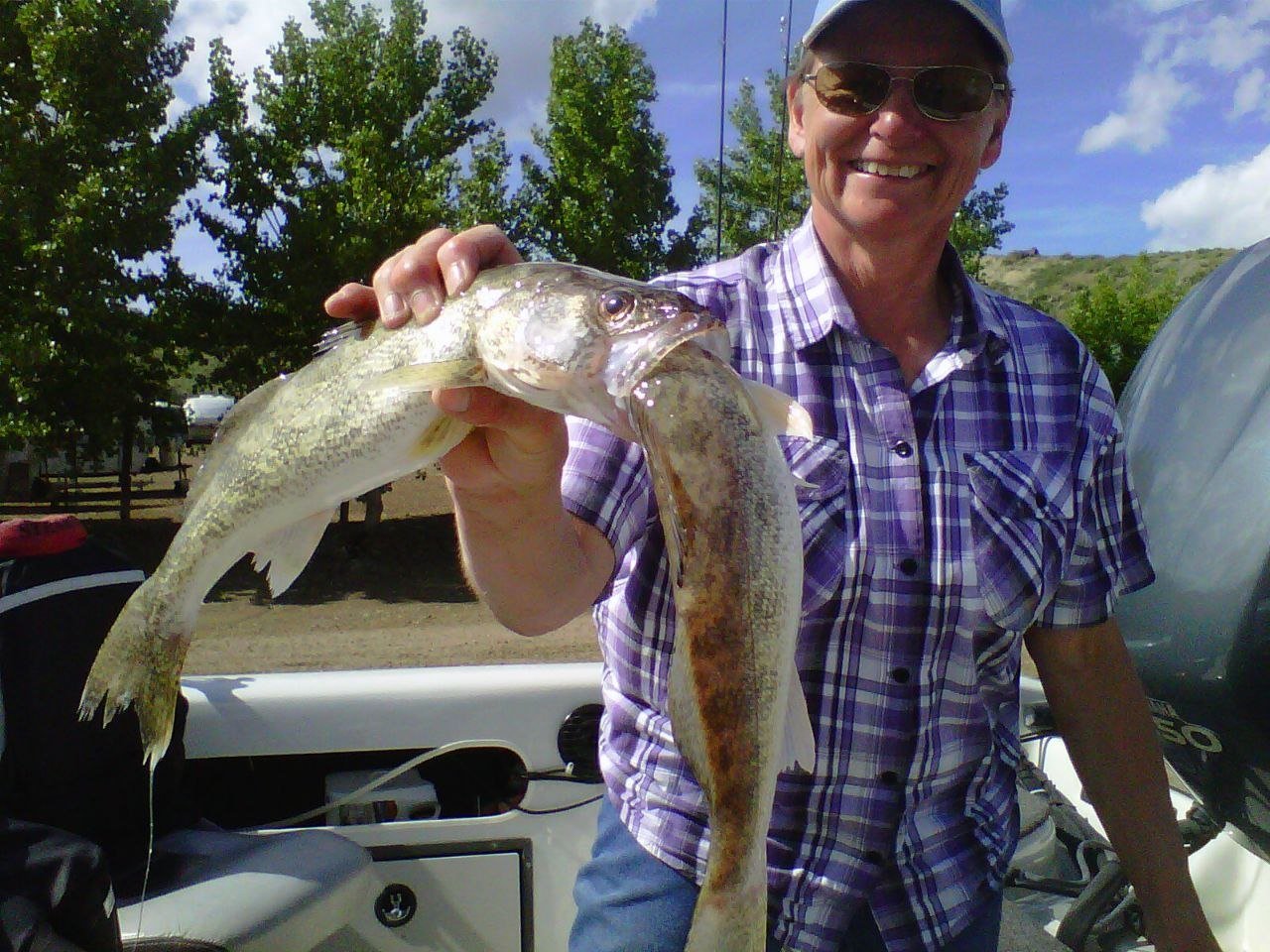 Angler holding a walleye