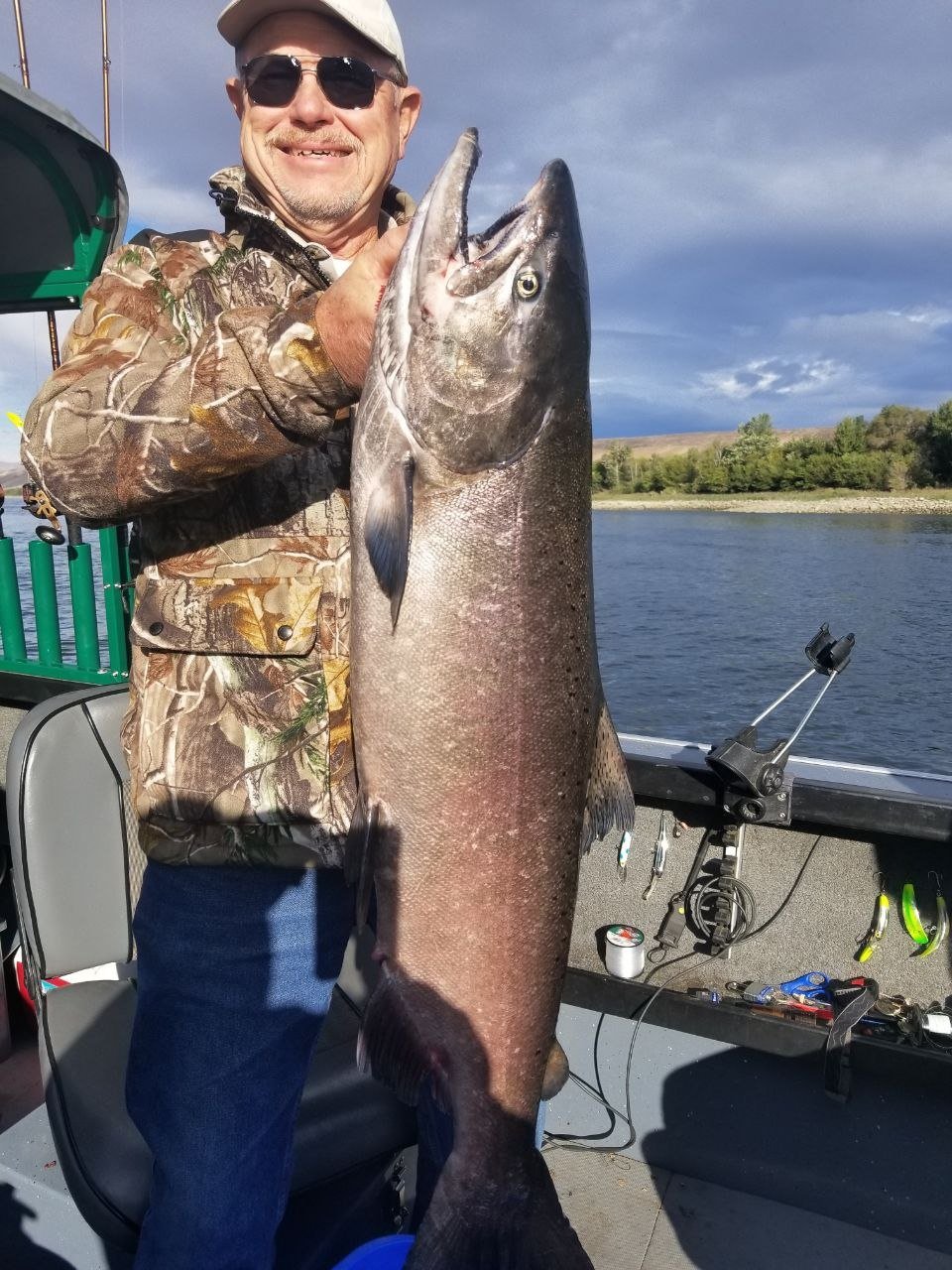 Angler holding a trophy sturgeon