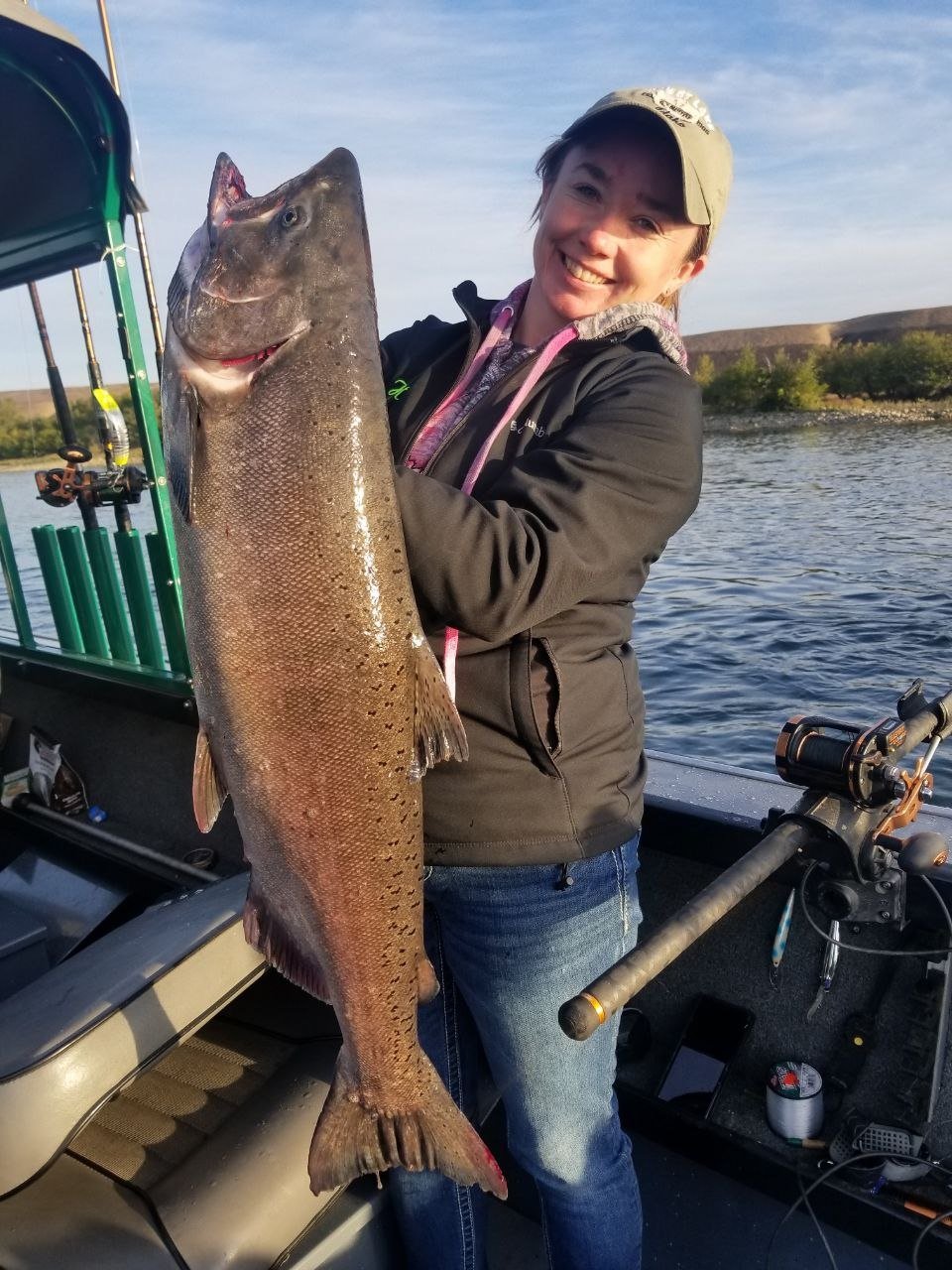 Angler holding a large sturgeon