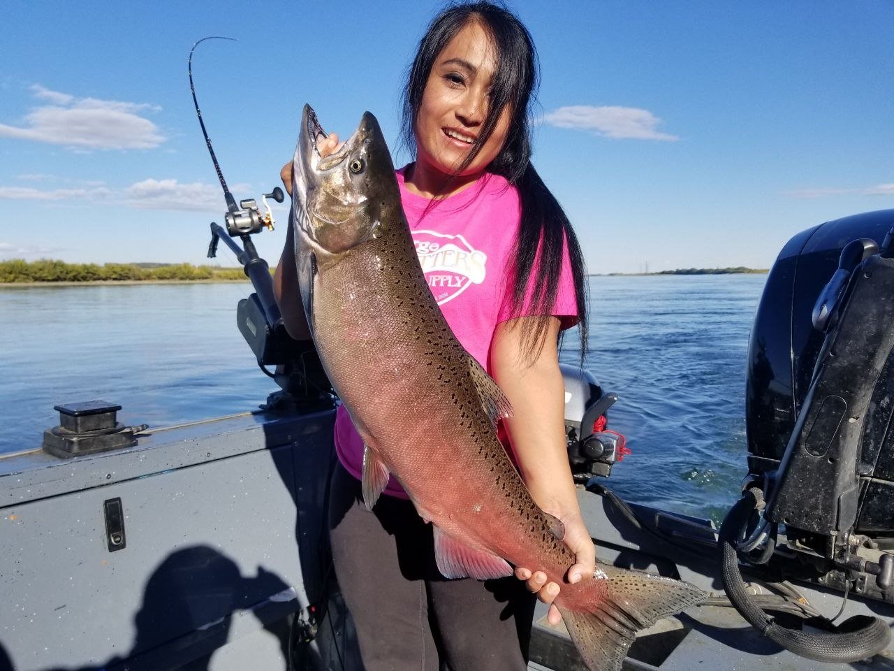 Woman holding a salmon