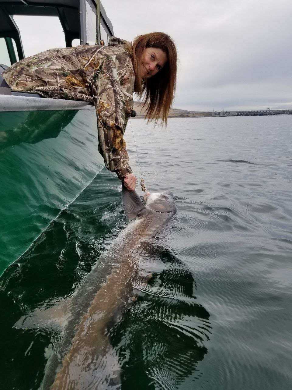 Angler releasing a salmon