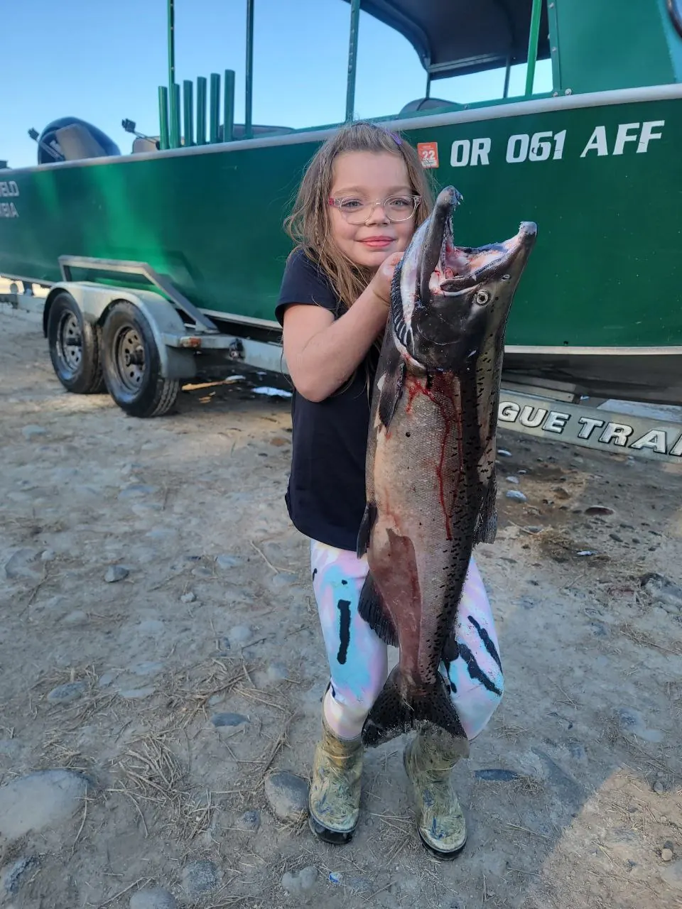 Young angler holding a Columbia River salmon