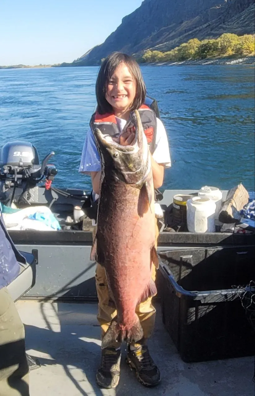 Customer holding a Columbia River salmon